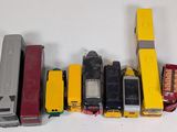 a lot of toy trucks that are lined up on a table