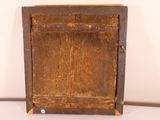 an old wooden cabinet with a door on it