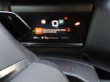 the dashboard of a car with a cell phone in the center of it