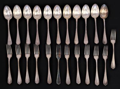 a lot of silver spoons and forks on a black background
