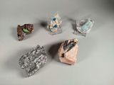several different types of rocks are displayed on a white surface