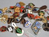 a lot of pins and badges on a table