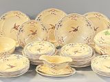 a picture of a large group of dishes and cups