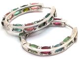 pair of multicolored tourmaline hoop earrings on a white background