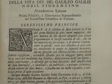 an old book with a black and white image on it