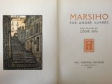 an open book with a picture of a street in it