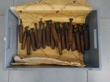 a bunch of cigars in a box on the floor