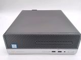 the front view of a desktop computer on a white surface
