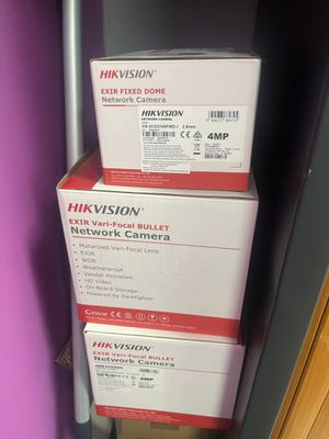 three boxes stacked on top of each other in a room
