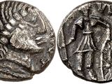 a silver coin with an image of a man on it