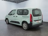 a green van that is parked in a room