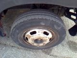 a flat tire on the flatbed of a truck