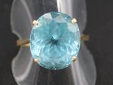 an image of a ring with a blue topazt stone in it
