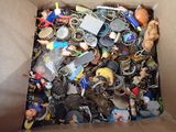a cardboard box filled with various types of keychains