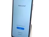an image of a cell phone with a welcome screen on the screen