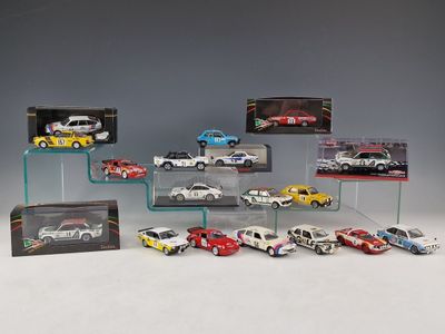 a lot of cars that are on display in a display case