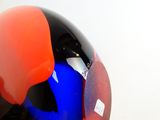 a helmet that has a red and blue design on it