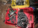 a red box with tools in it sitting on the floor