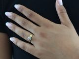 a woman with a ring on her left hand and a ring on her right hand