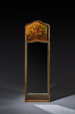an ornately decorated mirror in the shape of a mirror with flowers on it