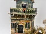 a miniature model of a house on display on a table