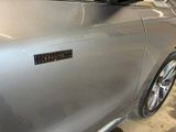 a close up of a car door with a sticker on it