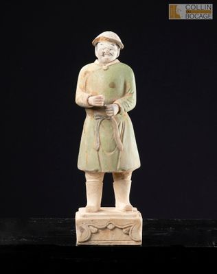 an old statue of a man with a cane stands on a black surface