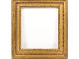 a gold picture frame with a white background