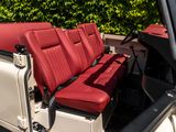 a red seat in the back of a white jeep