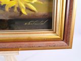 a picture of a painting of a sunflower in a gold frame