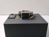a watch that is sitting on top of a box