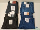 three pairs of men ' s jeans sitting on top of each other
