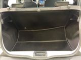 a car trunk with a phone in the back of it