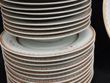 many plates stacked on top of each other on a table