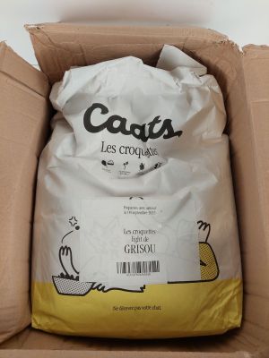 a bag of cat litter in a cardboard box