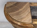 a small table with a marble top on it