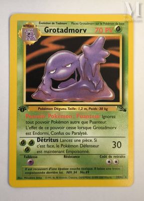 a close up of a pokemon card on a white surface