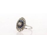 a close up of a ring on a table with a white background