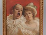 portrait of a man and a woman on an easel with a red background