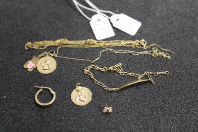 a close up of a bunch of jewelry on a table