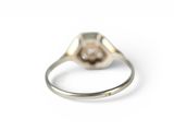 an image of a silver ring with a diamond in the center