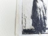 a black and white drawing of a man in a cloak