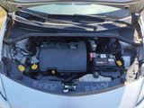 the engine of a car with its hood open and the hood open