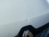 a close up of a car ' s front grill and hood