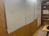 a white board on the wall in a room