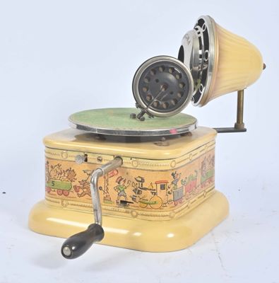 une petite boîte jaune sur laquelle est posé un disque