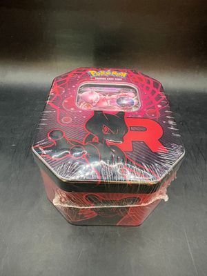 a small tin box with a black cat design on it
