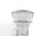 a glass bottle with a glass stopper on it