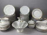 a lot of plates and cups and saucers on the table