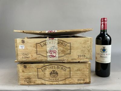 two wooden boxes of wine with a bottle of wine in front of them